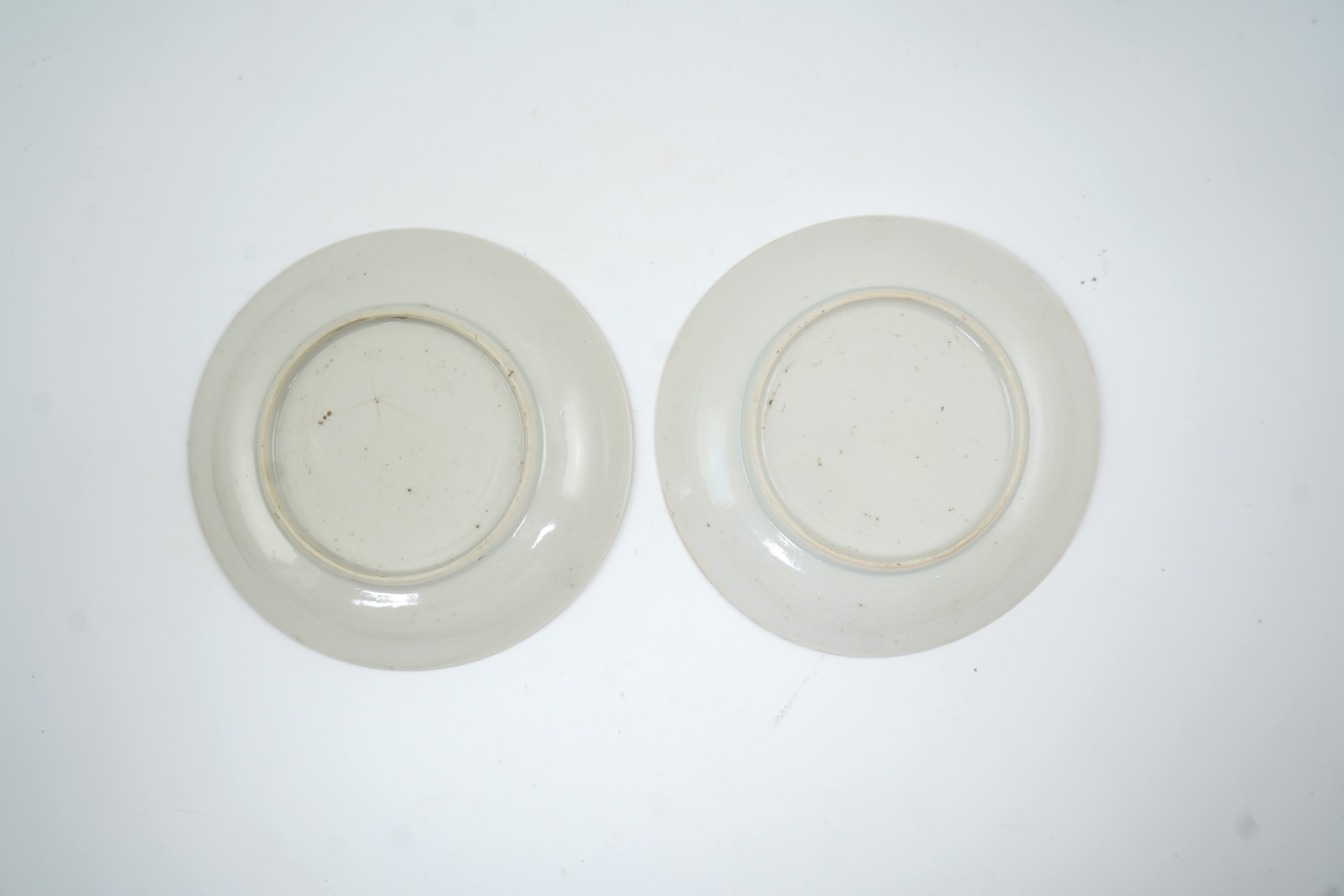 A near pair of Chinese famille rose ‘cockerel’ tea bowls and saucers, Yongzheng period